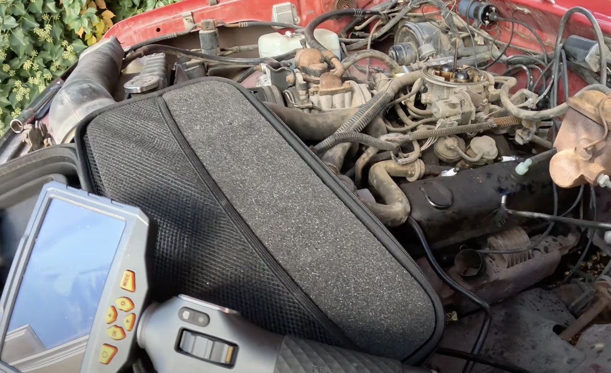 Las Vegas mobile mechanic using a borescope during engine diagnostics