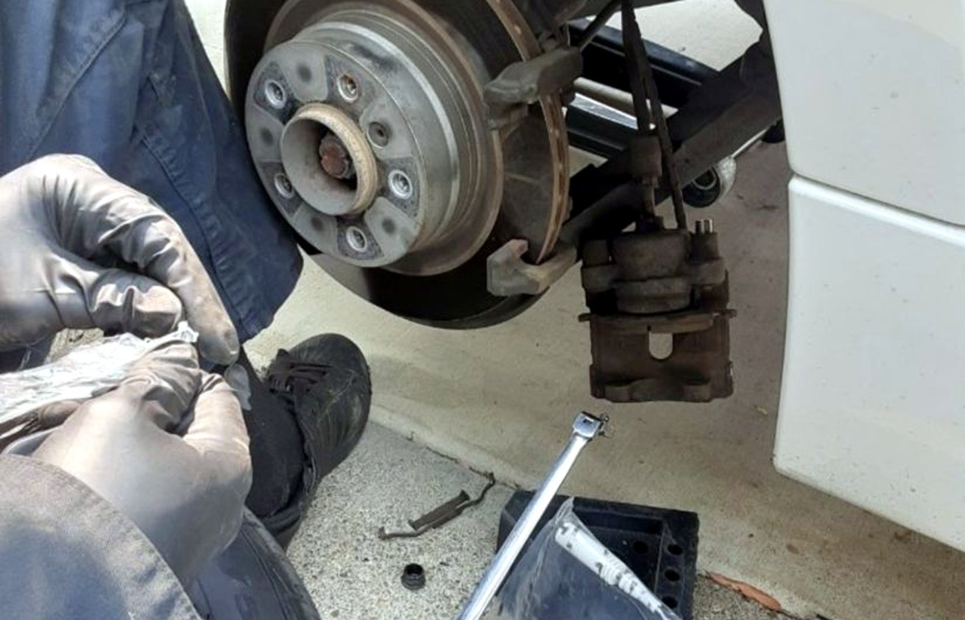 Las Vegas mobile mechanic running diagnostics in a desert driveway