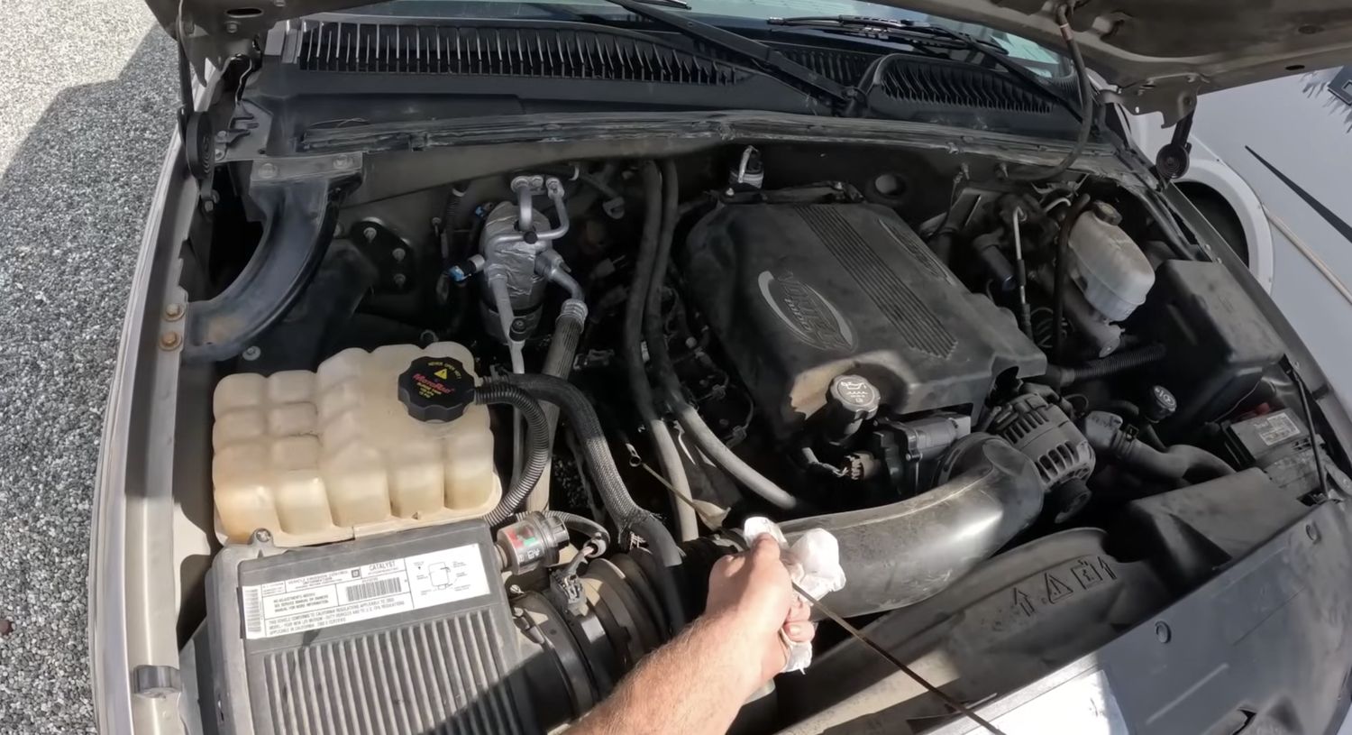 Battery and engine bay check for a parked car